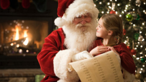 santa claus with a little girl on his lap
