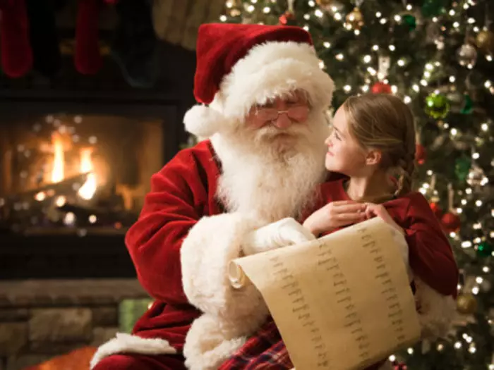 santa claus with a little girl on his lap